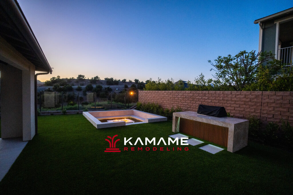 Custom fire pit and outdoor seating area at sunset, backyard remodel in Orange County CA