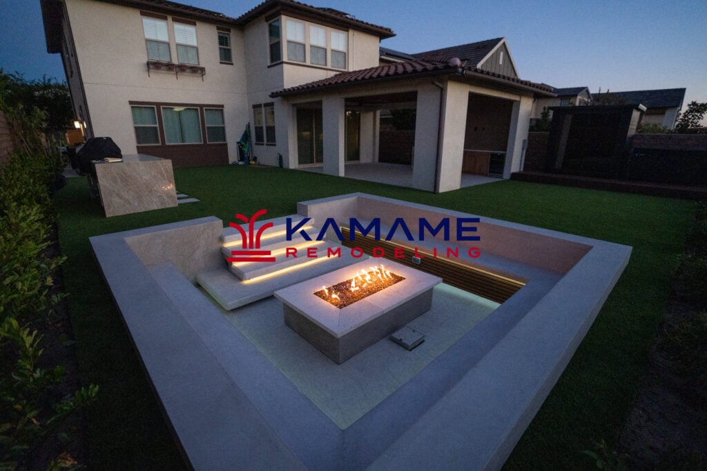 Outdoor fire pit seating area. Full backyard remodel in Orange County by Kamame