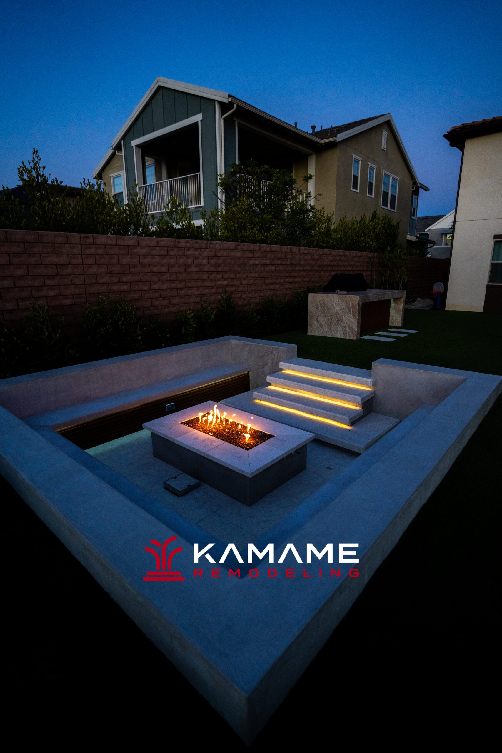 Outdoor fire pit seating area. Full backyard remodel in Orange County by Kamame