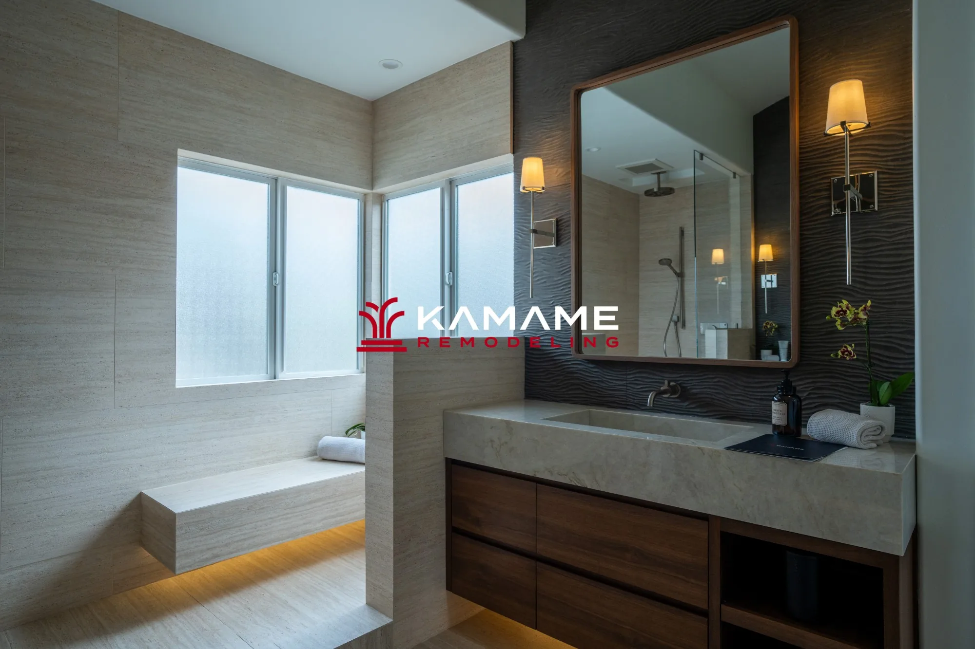 Bathroom remodel showing a floating shower bench with under-lighting and a framed vanity mirror